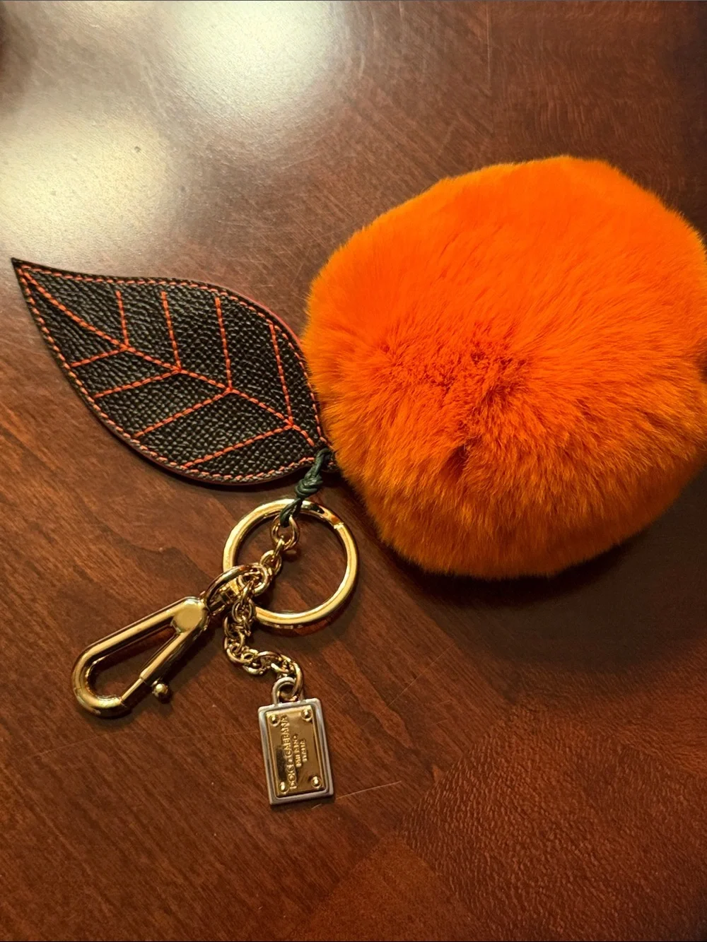 Dolce & Gabbana Orange  Mink Fur Pom-Pom Keychain with Black Leaf Accent